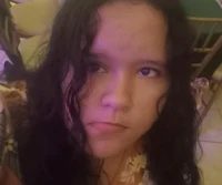 a woman with long hair is taking a selfie