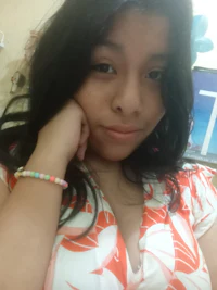 a girl with long hair posing for a picture